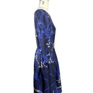 Side profile of Oscar de la Renta Pre-Fall 2017 navy fit-and-flare dress with three-quarter sleeves and laurel motif print