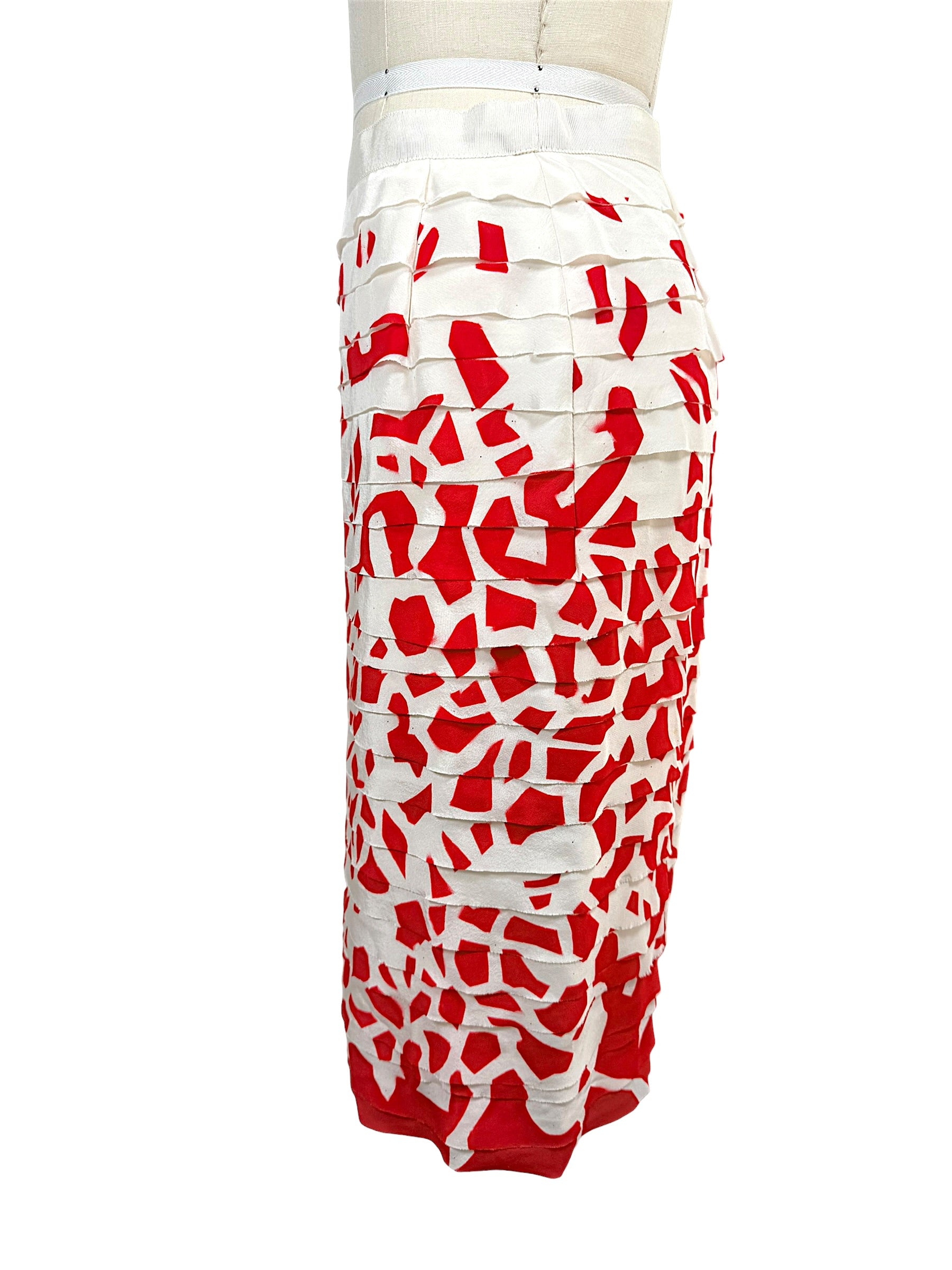 Side profile of vintage Oscar de la Renta ivory silk pencil skirt featuring red abstract print and layered appliqué detailing