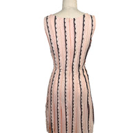Rear view of the Oscar de la Renta Resort 2014 blush pink sleeveless dress featuring a concealed back zipper and vertical black lace stripe detailing.