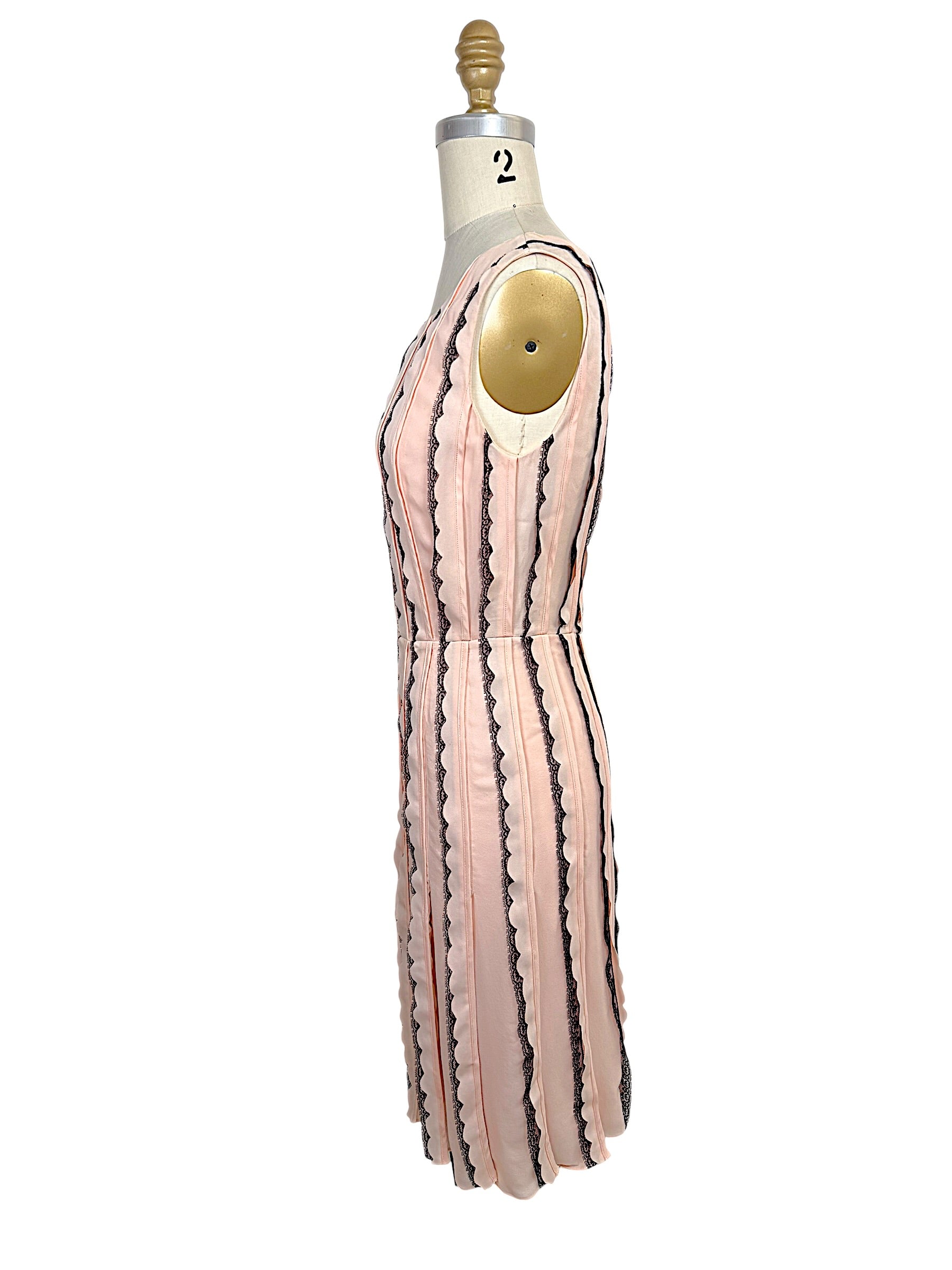 Right side profile of the Oscar de la Renta Resort 2014 blush pink dress illustrating the structured silhouette and elegant fit-and-flare construction.