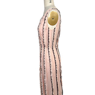 Right side profile of the Oscar de la Renta Resort 2014 blush pink dress illustrating the structured silhouette and elegant fit-and-flare construction.