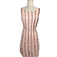 Oscar de la Renta Resort 2014 blush pink sleeveless dress featuring black lace stripe detailing and a fit-and-flare silhouette shown from the front.