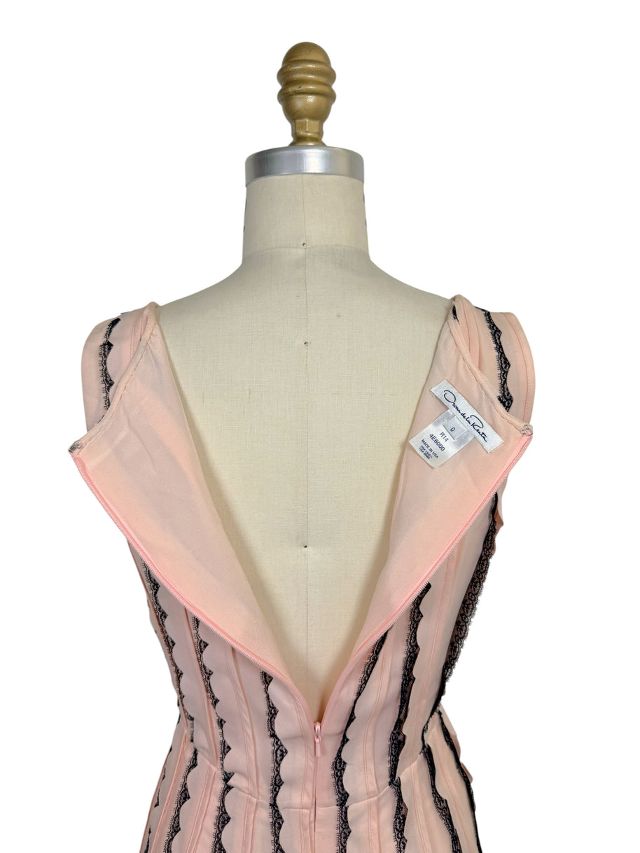 Interior view of the Oscar de la Renta Resort 2014 dress displaying the designer label, hidden zipper, and fully lined construction.