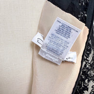 Close-up of Oscar de la Renta Resort 2018 dress composition and care tag with fabric details