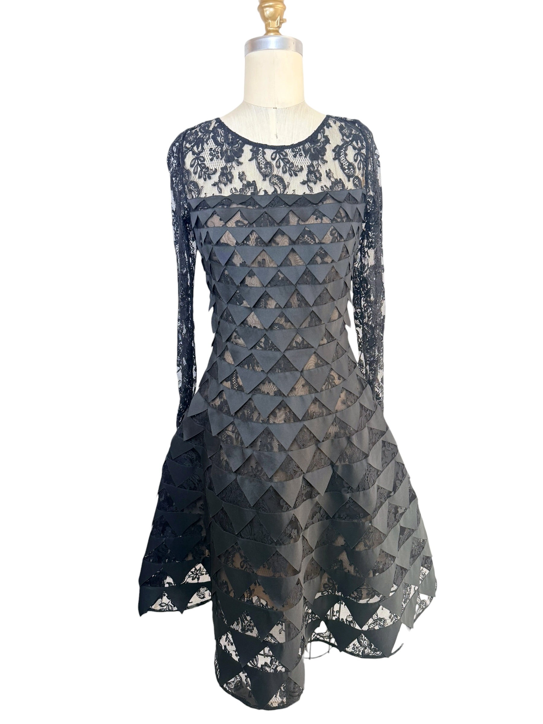 Oscar de la Renta Resort 2018 black lace cocktail dress with geometric appliqué detailing and asymmetric hem front full view