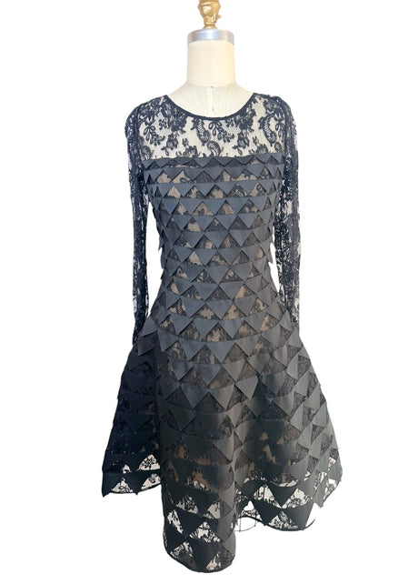 Oscar de la Renta Resort 2018 black lace cocktail dress with geometric appliqué detailing and asymmetric hem front full view