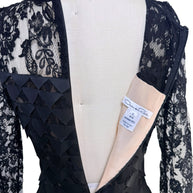 Interior label overview of Oscar de la Renta Resort 2018 black lace dress showing back zipper and designer tags