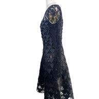 Right side profile of Oscar de la Renta Resort 2018 black lace geometric appliqué dress