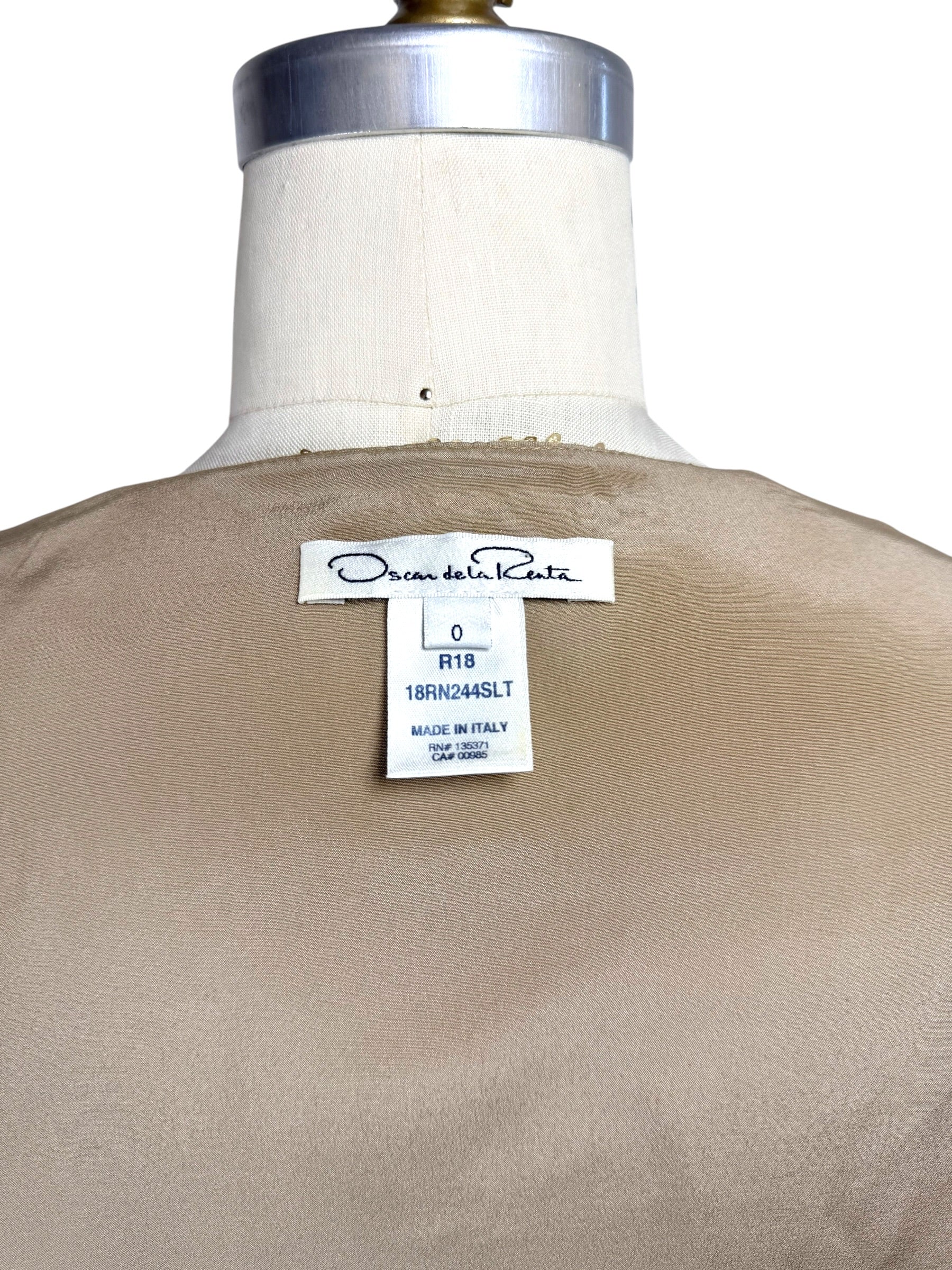 Close-up of Oscar de la Renta Resort 2018 dress interior size and production label