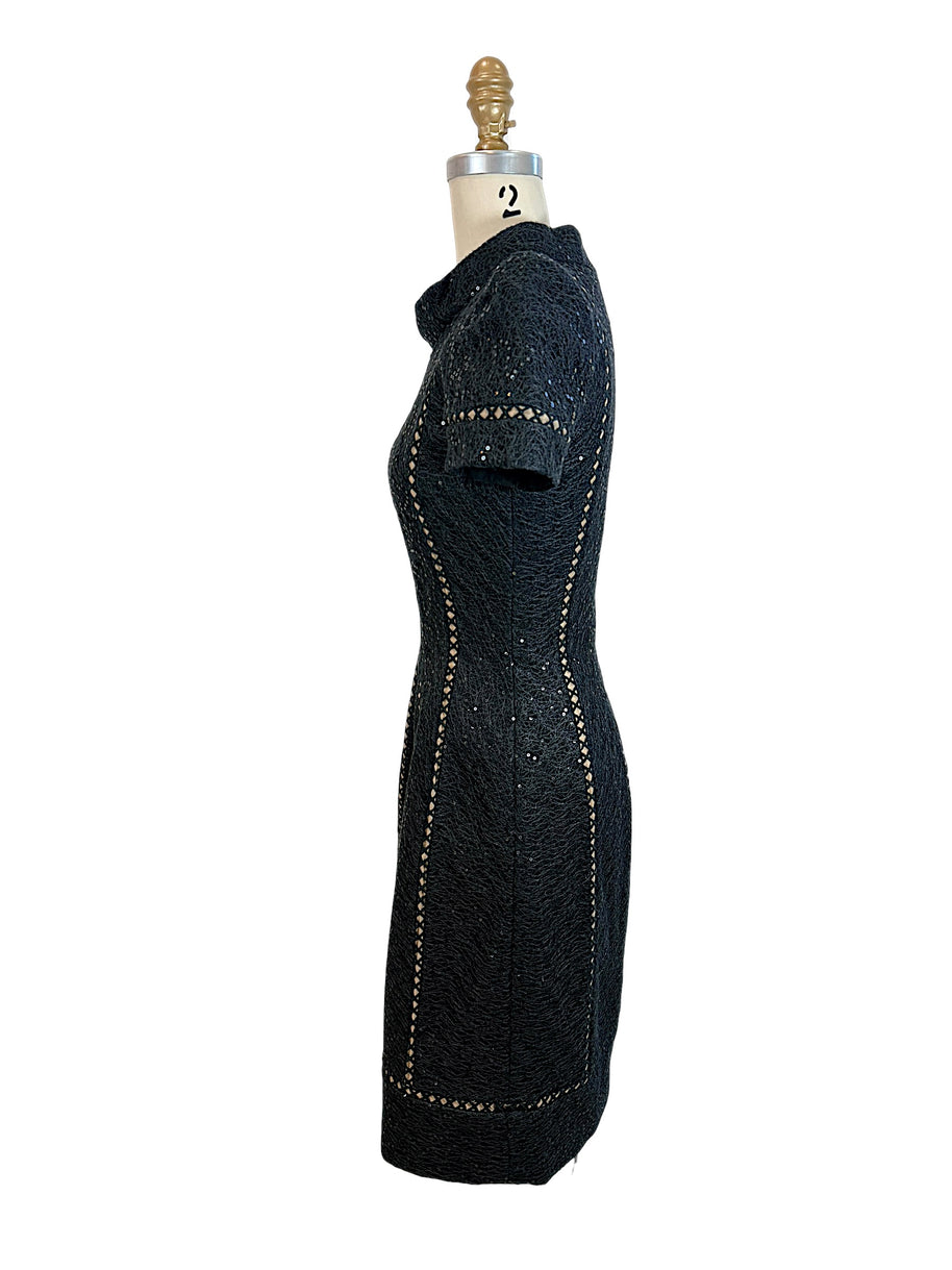 Oscar de la Renta Spring 2013 P13 black textured sequin cocktail dress left side profile with short sleeves and sculpted silhouette