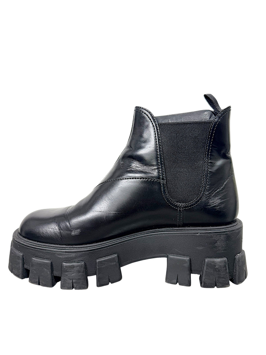 Opposite side profile of Prada Monolith black leather Chelsea boot size 38 showing leather upper and lug sole