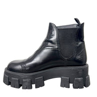 Opposite side profile of Prada Monolith black leather Chelsea boot size 38 showing leather upper and lug sole