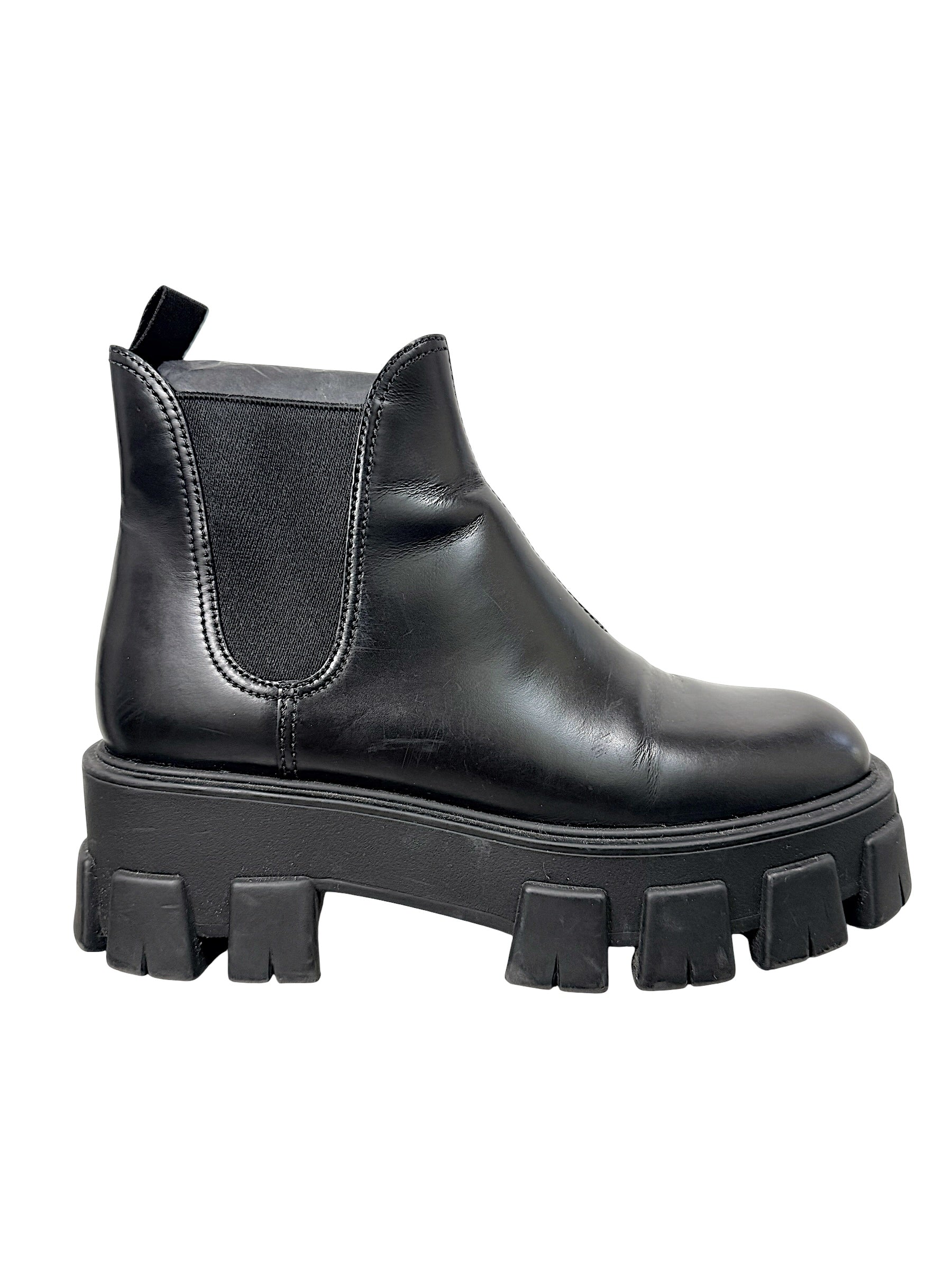 Side profile of Prada Monolith black leather Chelsea boot with elastic gusset and chunky platform lug sole