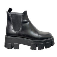 Side profile of Prada Monolith black leather Chelsea boot with elastic gusset and chunky platform lug sole