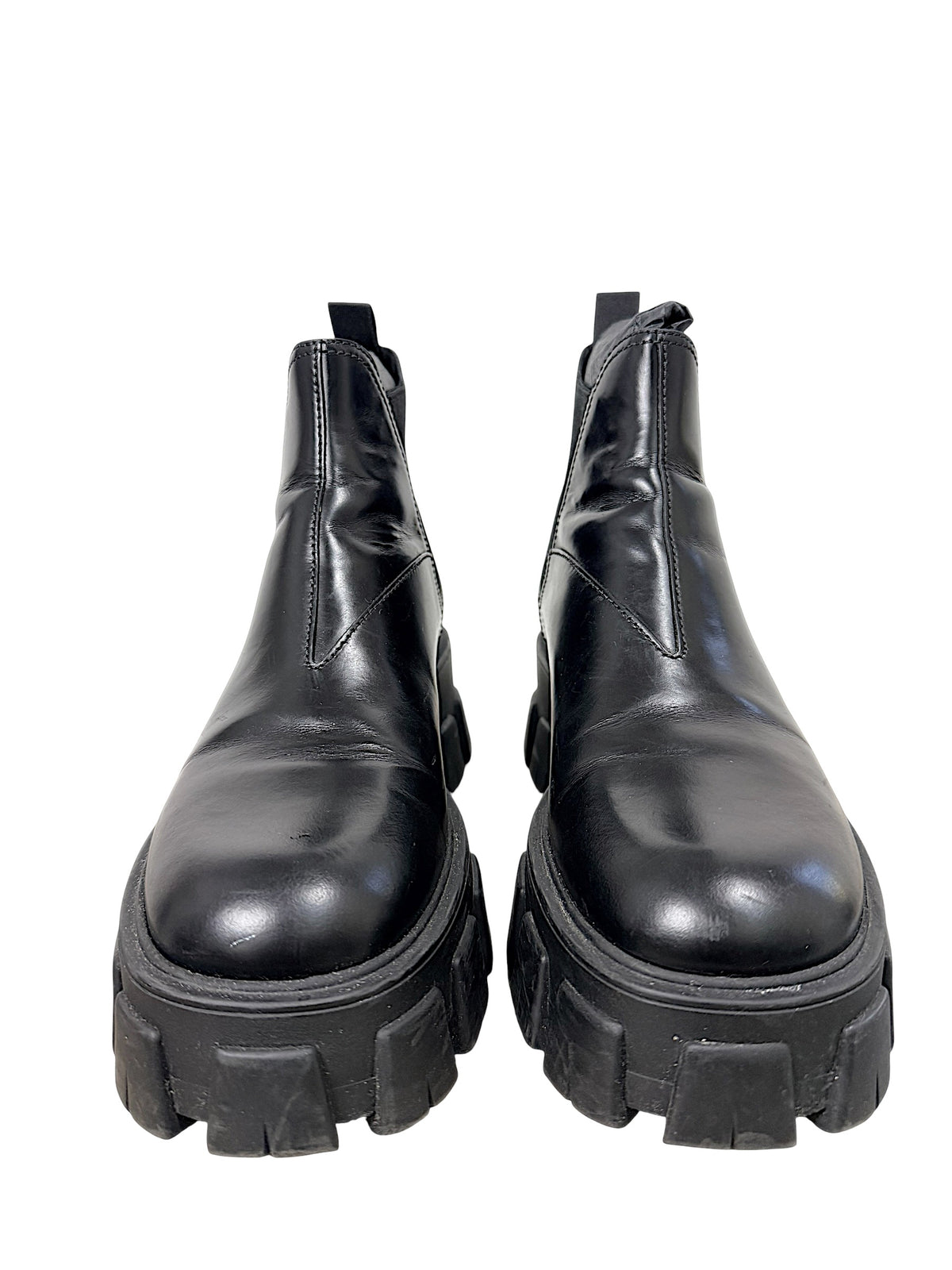 Front view of Prada Monolith black leather Chelsea boots size 38 with oversized lug soles