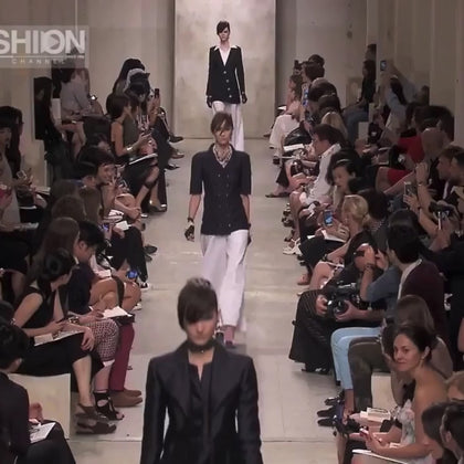 Runway video of Chanel Cruise 2014 Look 11 featuring the double-breasted textured tweed jacket in an alternate navy colorway, included as runway documentation for the ivory jacket listing.