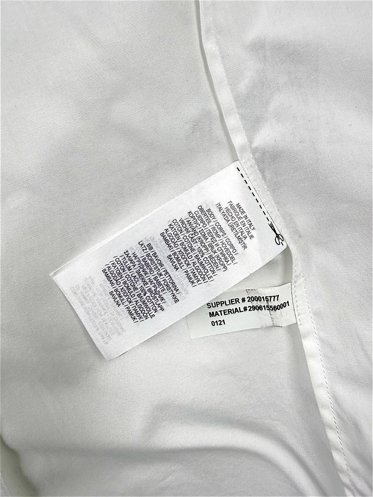 Interior manufacturing and care labels of Ralph Lauren Purple Label white tuxedo shirt showing Made in Italy and material number 290615560001.