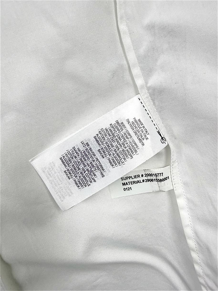 Interior manufacturing and care labels of Ralph Lauren Purple Label white tuxedo shirt showing Made in Italy and material number 290615560001.