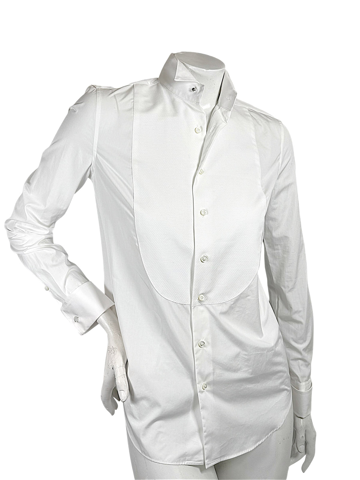 Angled front view of Ralph Lauren Purple Label women's white tuxedo shirt with elongated piqué bib, fitted silhouette and formal collar.