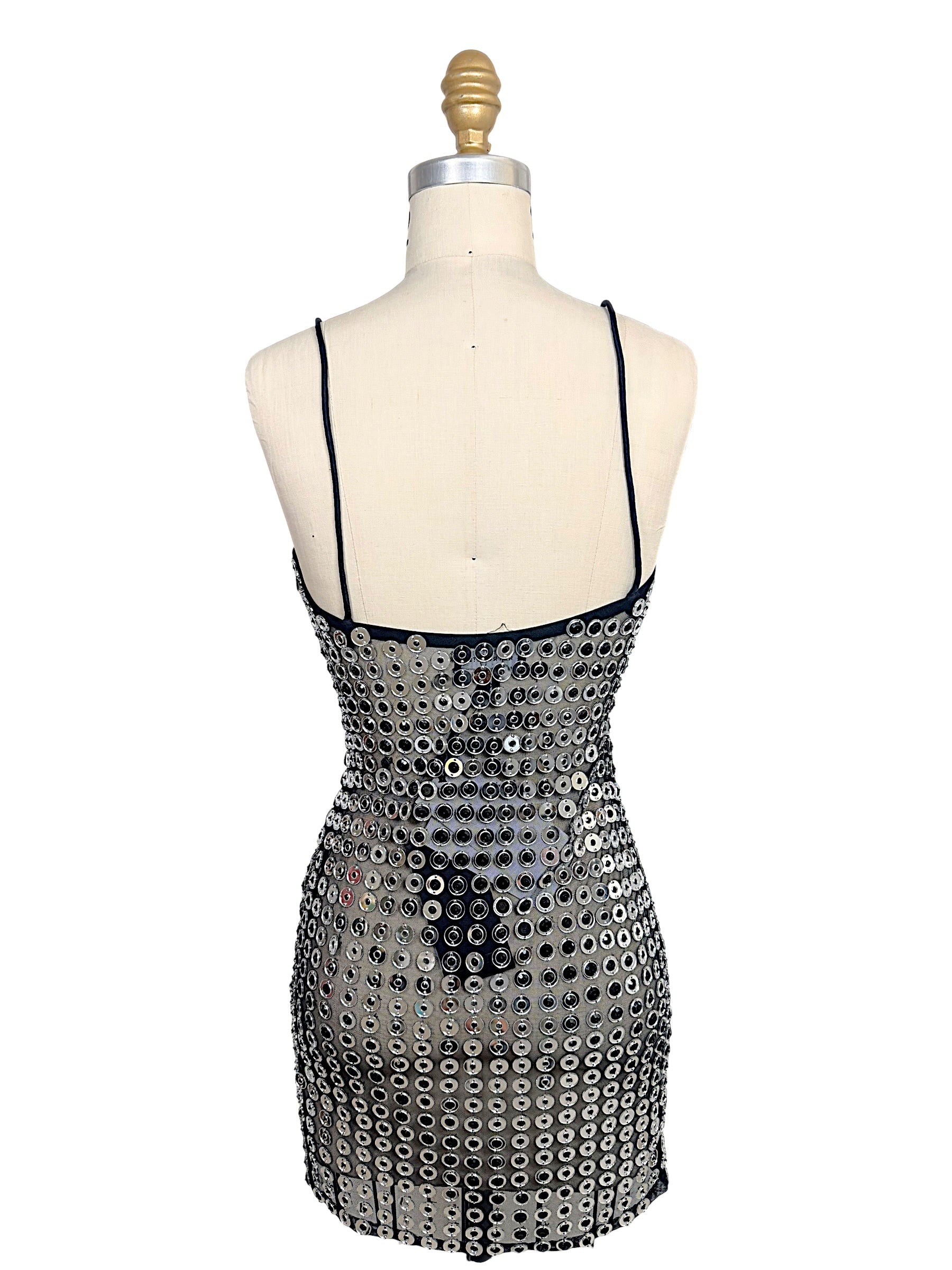 Back view of Retrofête Maddy black mesh mini dress with silver mirrored disc embellishments and low back