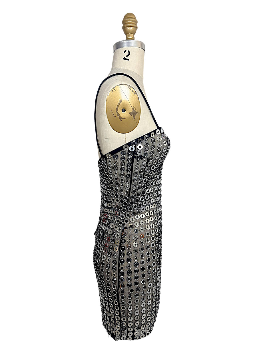 Side view of Retrofête Maddy mini dress with silver mirrored disc embellishments and thin black straps