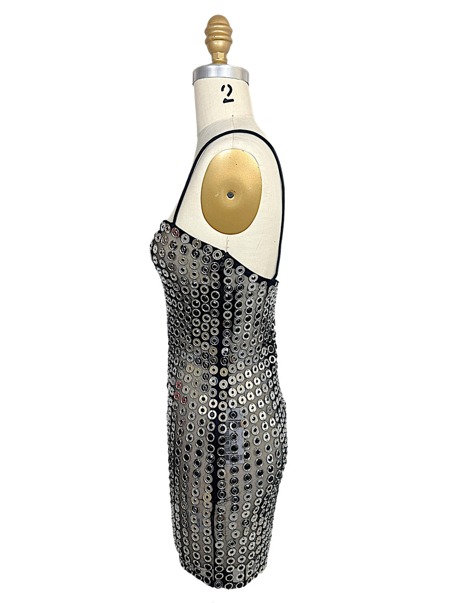 Opposite side view of Retrofête Maddy silver mirrored disc mini dress showing fitted bodycon silhouette