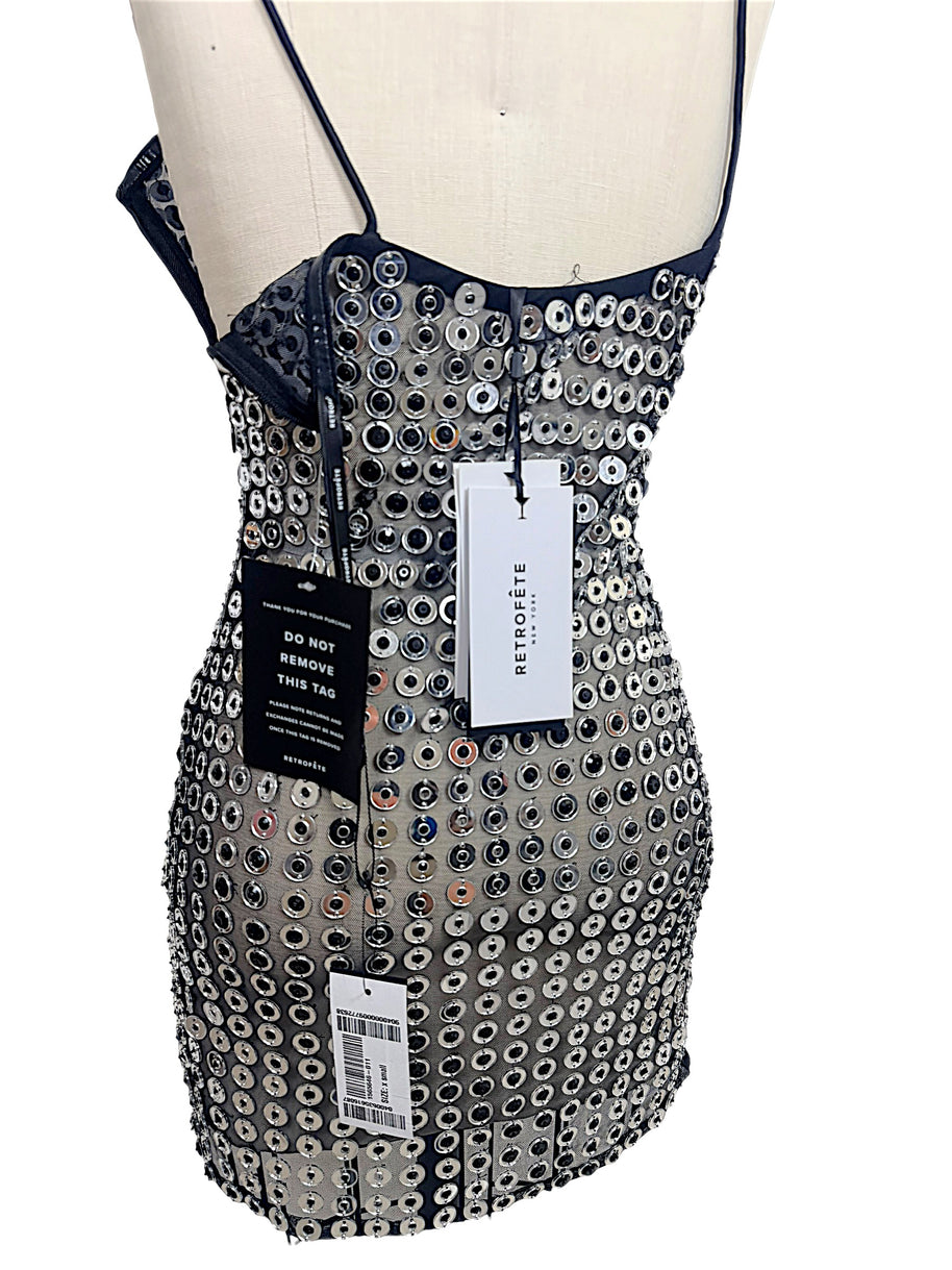 Back detail of Retrofête Maddy XS mini dress showing closure, silver embellishments and original retail hang tags