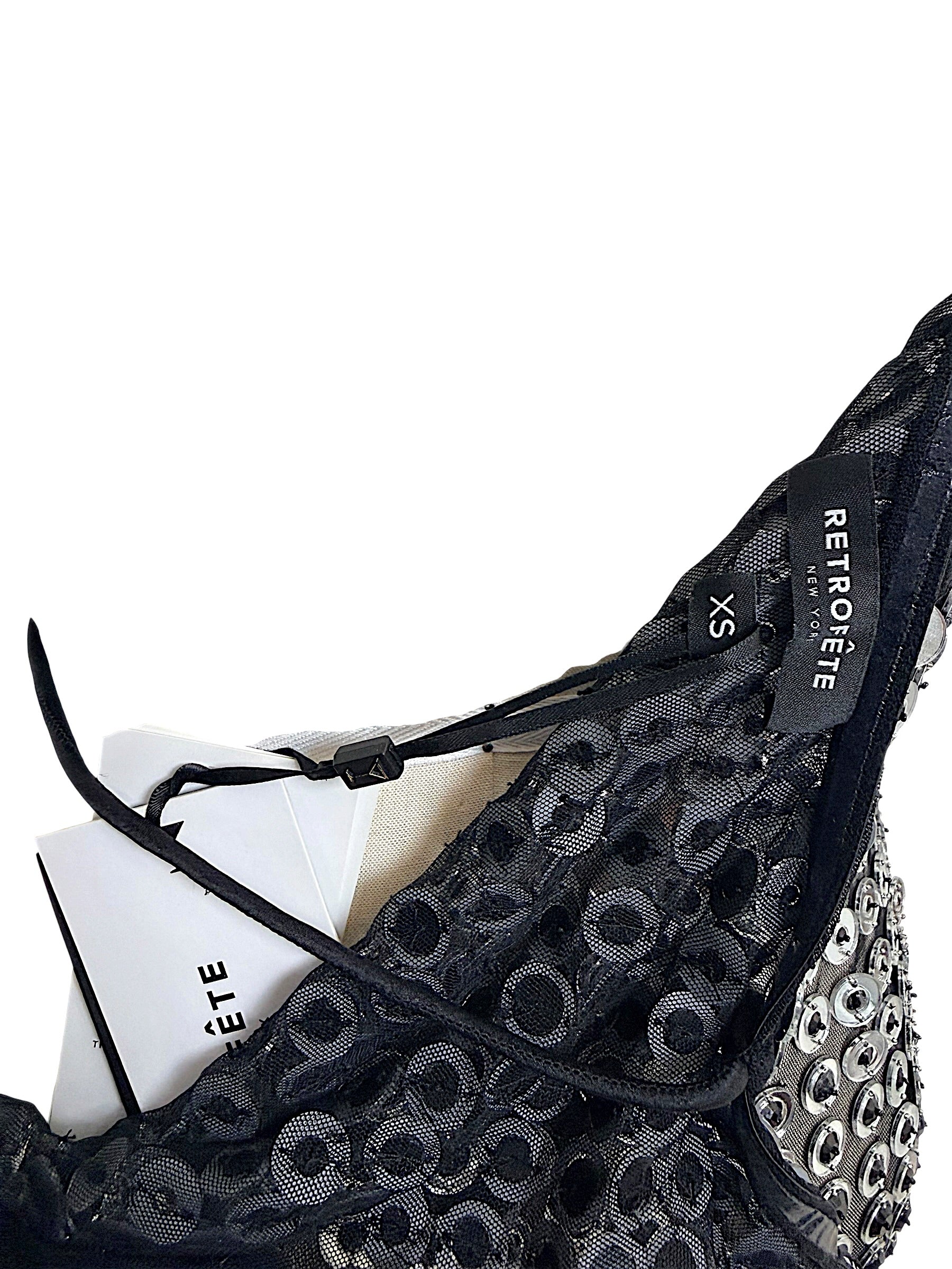 Interior close-up of Retrofête Maddy dress showing black lace construction and Retrofête New York size XS label
