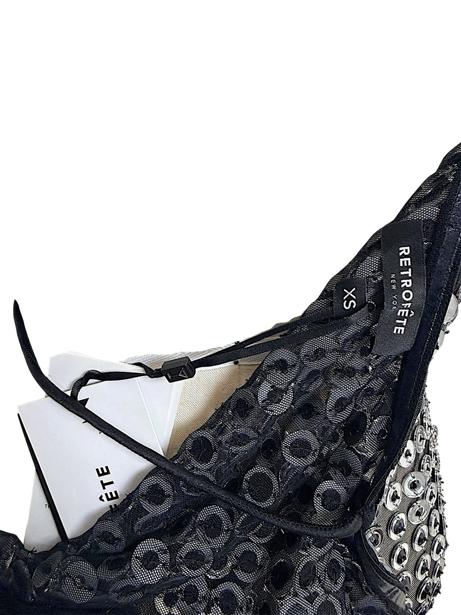 Interior close-up of Retrofête Maddy dress showing black lace construction and Retrofête New York size XS label