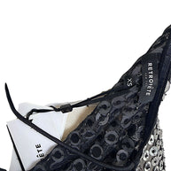 Interior close-up of Retrofête Maddy dress showing black lace construction and Retrofête New York size XS label