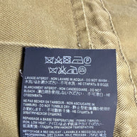 Saint Laurent Paris military utility jacket interior care label with professional dry cleaning instructions and garment care symbols.