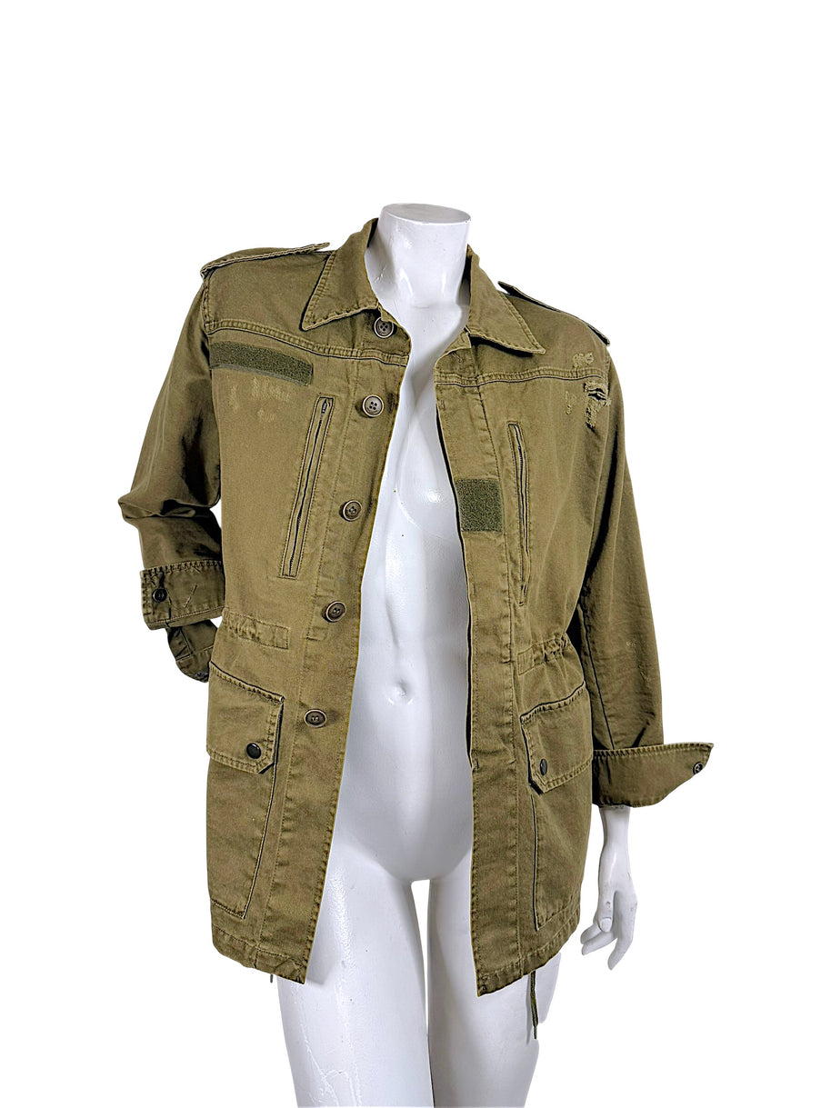 Saint Laurent Paris olive green military jacket worn open showing button-front closure, adjustable waist and oversized utility pockets