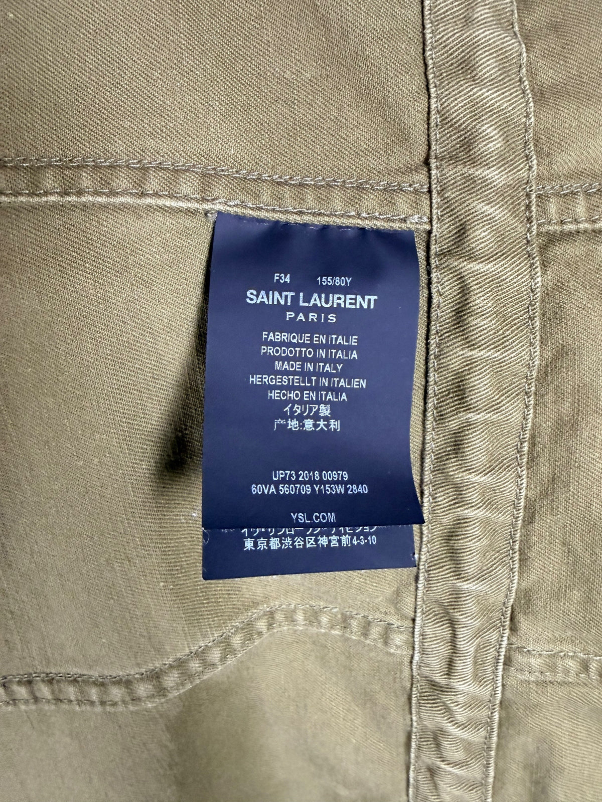 Saint Laurent Paris military jacket interior authenticity details showing French size 34, Made in Italy label and product reference 560709 Y153W.