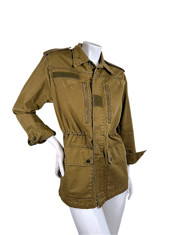 Three-quarter front view of Saint Laurent olive green military utility jacket featuring gathered waist and distressed cotton twill