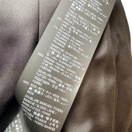 Saint Laurent green tweed jacket care and composition label detail