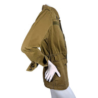 Side profile of Saint Laurent Fall 2018 olive green field jacket showing sleeve construction, adjustable waist and flap pocket