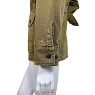 Saint Laurent olive green cotton blend military jacket sleeve detail showing intentional distressed fabric, fraying and buttoned cuff.