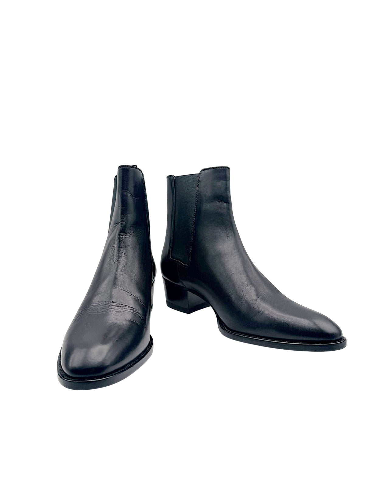 Saint Laurent Paris women's black leather Chelsea ankle boots size EU 38, front angled view showing almond toes and low block heels.