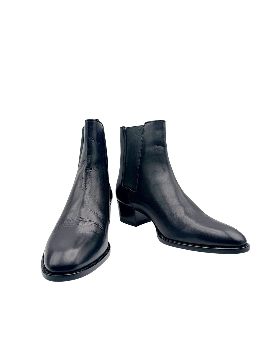 Saint Laurent Paris women's black leather Chelsea ankle boots size EU 38, front angled view showing almond toes and low block heels.