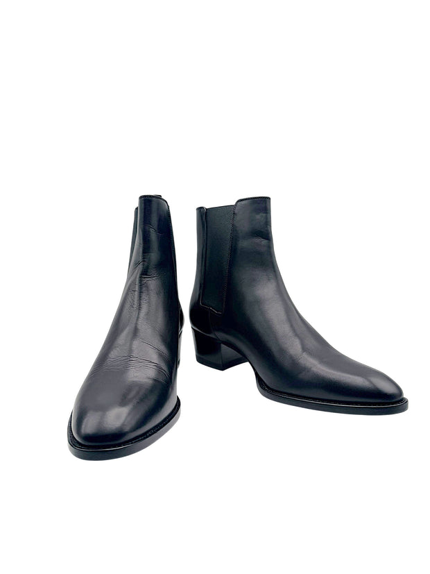 Saint Laurent Paris women's black leather Chelsea ankle boots size EU 38, front angled view showing almond toes and low block heels.