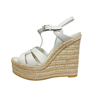 Inner side view of Saint Laurent Tribute white leather platform wedge sandal showing layered natural jute espadrille construction