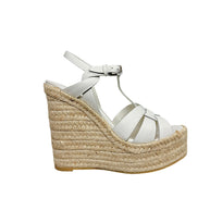 Side profile of Saint Laurent Tribute white leather espadrille sandal with natural braided jute platform wedge