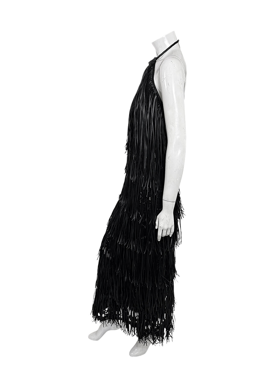 Profile view of Silvia Tcherassi Susa black fringe maxi dress with layered floor-length fringe