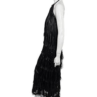 Profile view of Silvia Tcherassi Susa black fringe maxi dress with layered floor-length fringe
