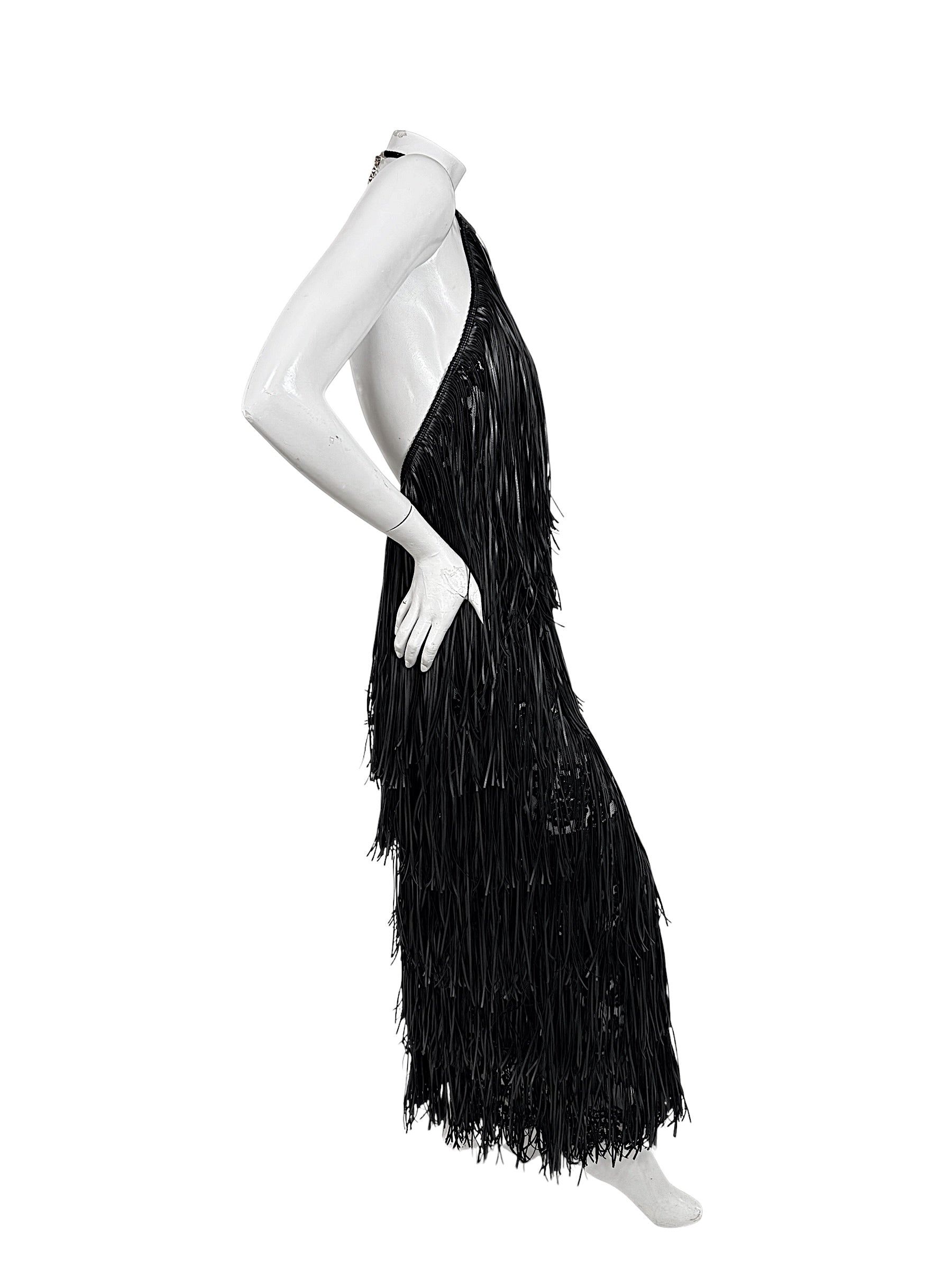 Side view of Silvia Tcherassi Susa black fringe halter dress showing open-back silhouette