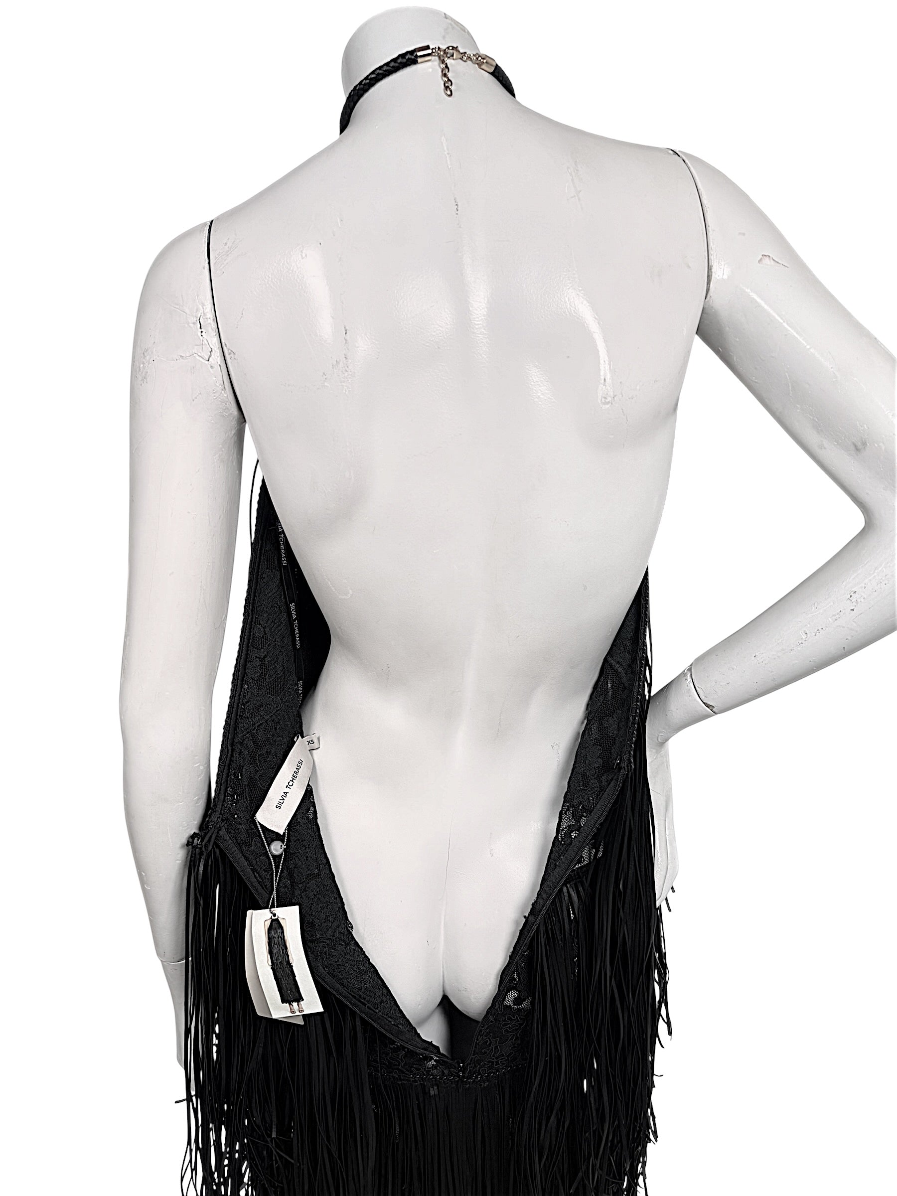 Close-up back view of Silvia Tcherassi Susa Resort 2024 dress showing plunging open back and halter closure