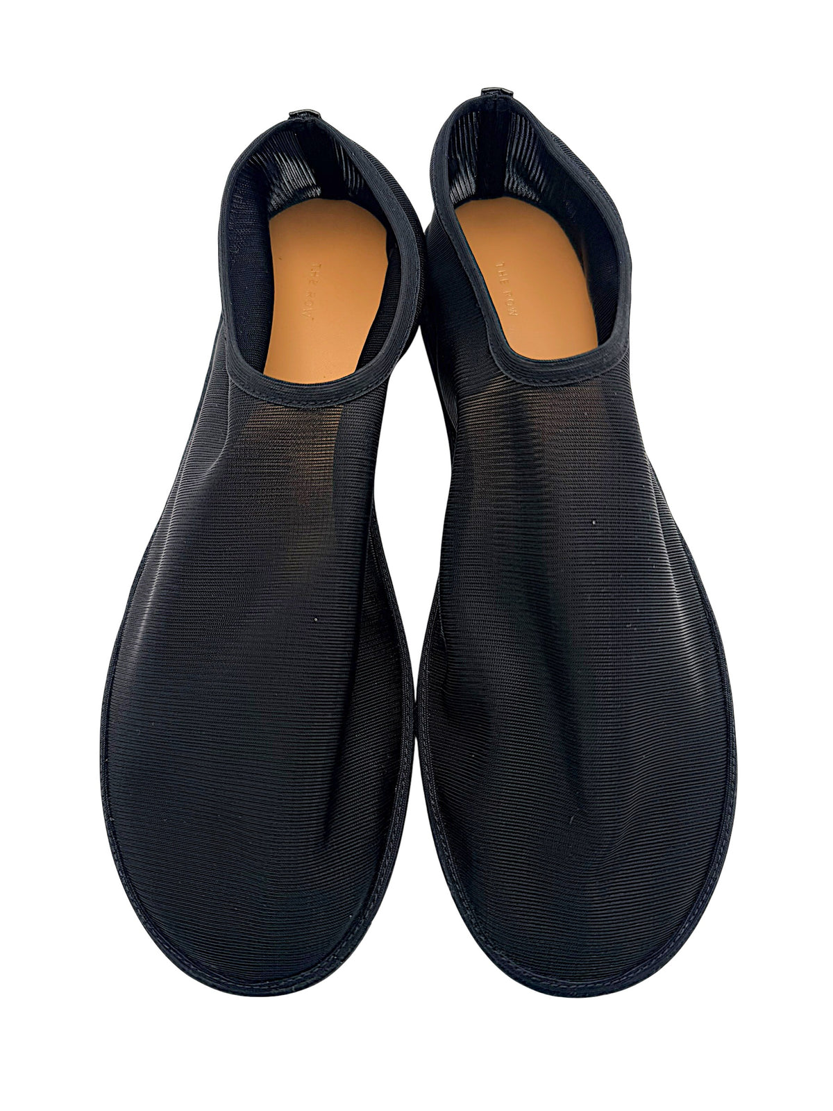 Overhead view of The Row black sheer mesh sock flats in EU 38, showing both rounded toes, ribbed uppers and tan leather footbeds.
