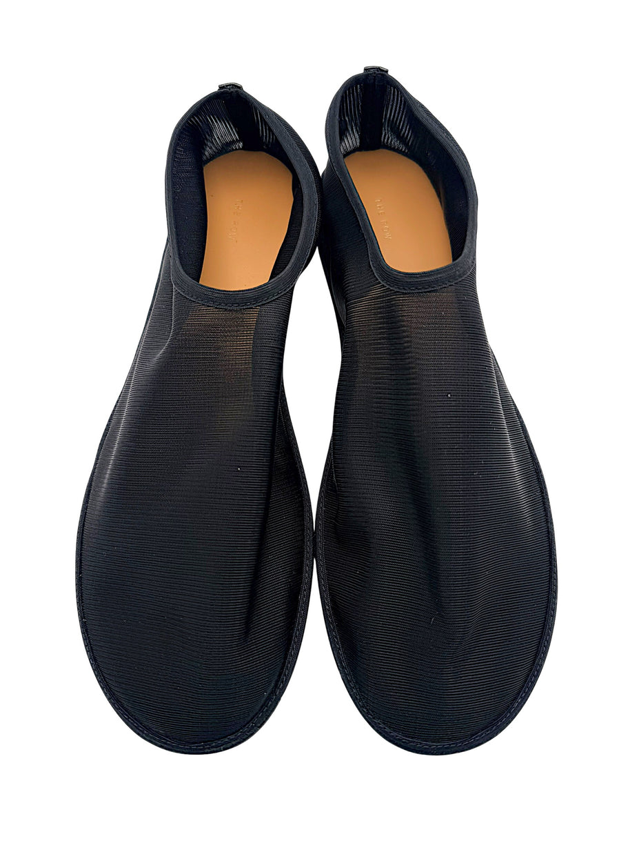 Overhead view of The Row black sheer mesh sock flats in EU 38, showing both rounded toes, ribbed uppers and tan leather footbeds.