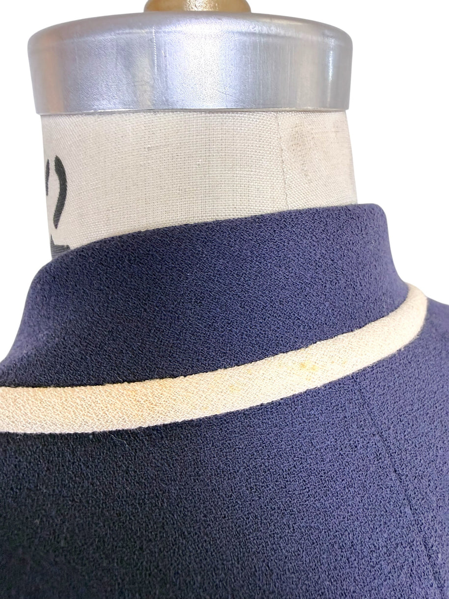 Detailed view of Valentino navy blazer collar and ivory contrast trim