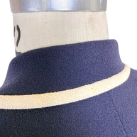 Detailed view of Valentino navy blazer collar and ivory contrast trim